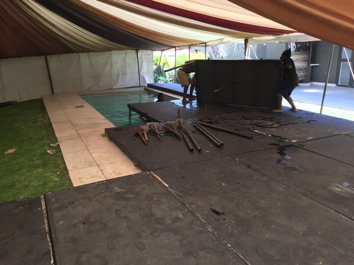Event flooring installation by Funktion Flooring near a pool