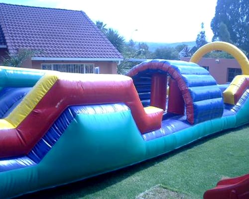 Colorful toddler adventure course in an outdoor setting