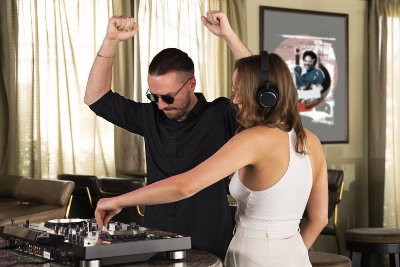 DJ performing with a guest at an event