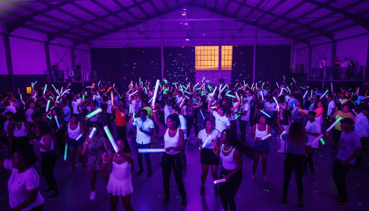 Guests dancing under UV lights